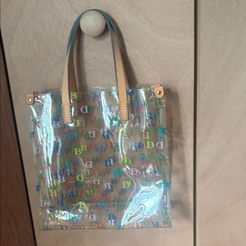 Dooney & Bourke Clear Tote With Multicolor Db Logos And Tan Handles